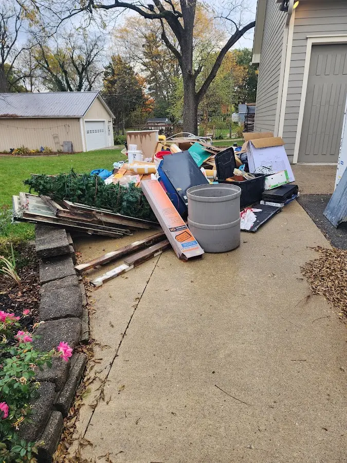 Dumpster being loaded with debris for Commercial Dumpster Rental in Countryside